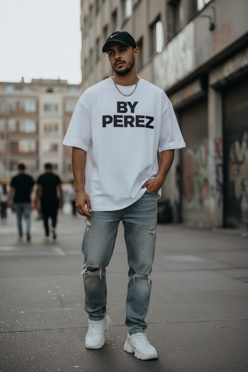 Man wearing BY PEREZ white bold logo t-shirt